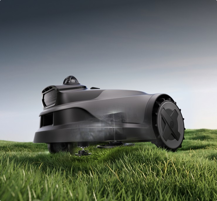 Rugged terrain traversal system navigating bumpy turf and sloped lawn ground