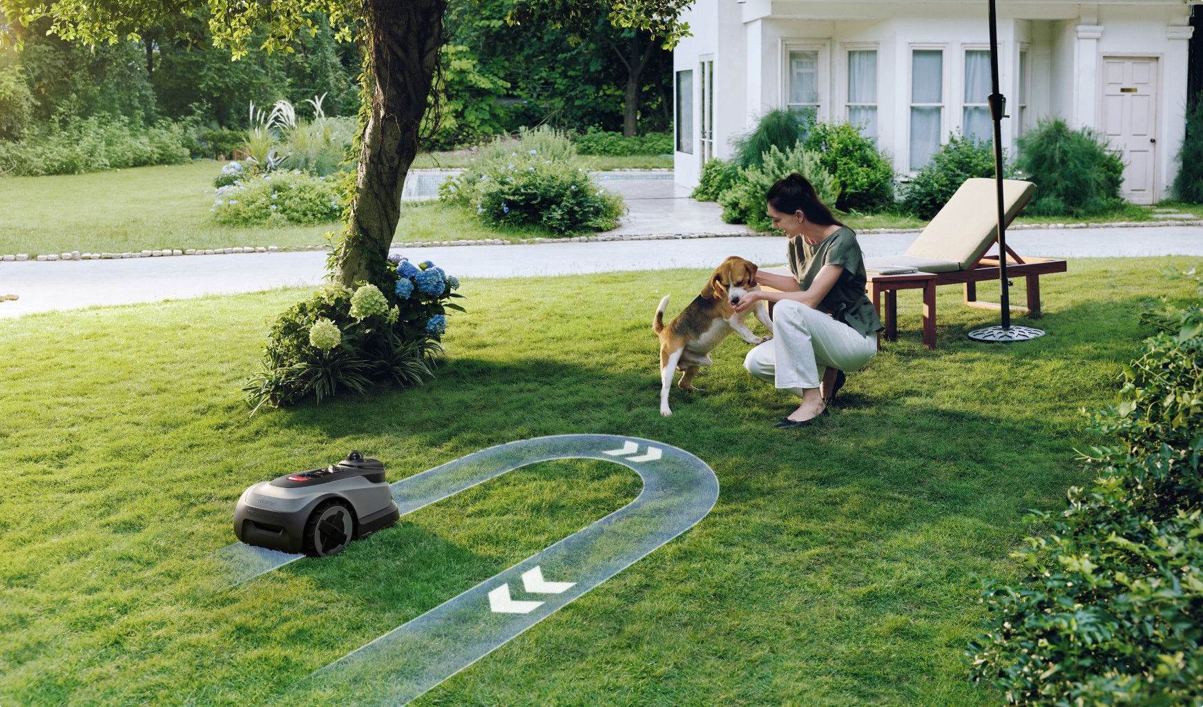 Autonomous mower making a safe turn to steer clear of person and family dog